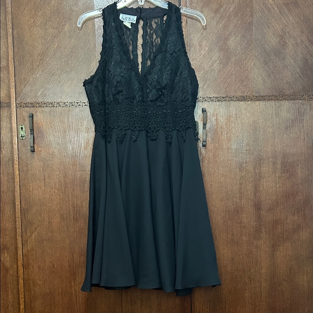 Anna black halter cocktail dress featuring a sheer floral lace back fully lined